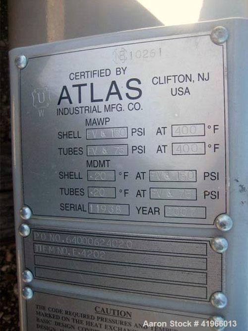Unused- Atlas Industrial Single Pass Shell and Tube Heat Exchanger, 1274 square feet, vertical, type BEM 26-144. Carbon steel shell rated FV/150 psi at -20 to 400 deg F. (552) 3/4" diameter x 12’ lon...