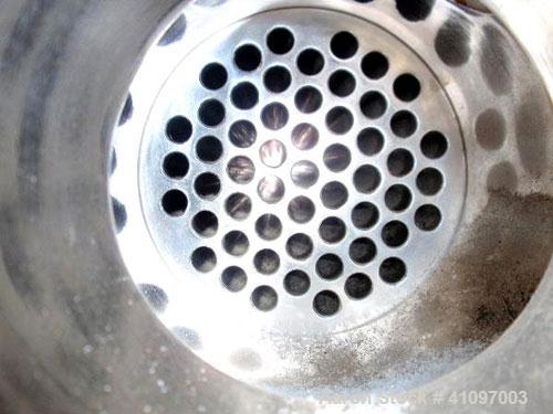 Used Atlas Industrial Shell and Tube Heat Exchanger, 43 square feet, vertical. Carbon steel shell rated full vaccum and 150 psi at 450 deg F, (55) 3/4" diameter x 4' long 316L stainless steel tubes r...