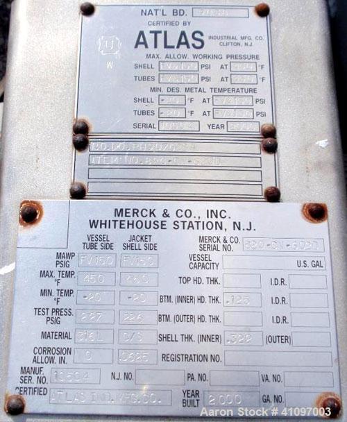 Used Atlas Industrial Shell and Tube Heat Exchanger, 43 square feet, vertical. Carbon steel shell rated full vaccum and 150 psi at 450 deg F, (55) 3/4" diameter x 4' long 316L stainless steel tubes r...