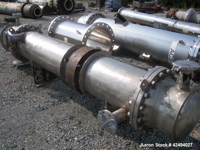Used Atlas Heat shell and tube exchanger, 403 square feet. 316L stainless steel tubes, tube sheets, shell and bonnets, with (257) .75" x 8' long tubes, rated 100 psi and full vacuum at 300 f tube sid...