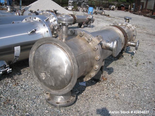 Used Atlas Heat shell and tube exchanger, 403 square feet. 316L stainless steel tubes, tube sheets, shell and bonnets, with (257) .75" x 8' long tubes, rated 100 psi and full vacuum at 300 f tube sid...