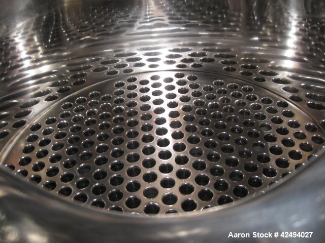 Used Atlas Heat shell and tube exchanger, 403 square feet. 316L stainless steel tubes, tube sheets, shell and bonnets, with (257) .75" x 8' long tubes, rated 100 psi and full vacuum at 300 f tube sid...