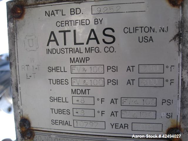 Used Atlas Heat shell and tube exchanger, 403 square feet. 316L stainless steel tubes, tube sheets, shell and bonnets, with (257) .75" x 8' long tubes, rated 100 psi and full vacuum at 300 f tube sid...