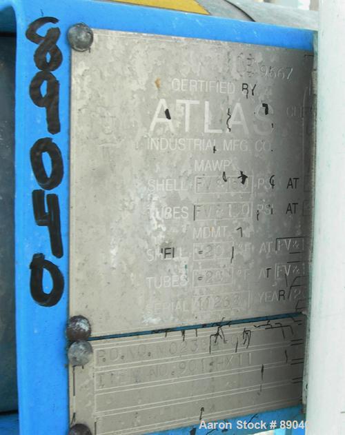 USED: Atlas four pass shell and tube heat exchanger, 17.6 square feet, horizontal. Carbon steel shell rated FV and 150 psi at 400 deg F, (28) 5/8" diameter x 4' long 316L stainless steel tubes rated ...