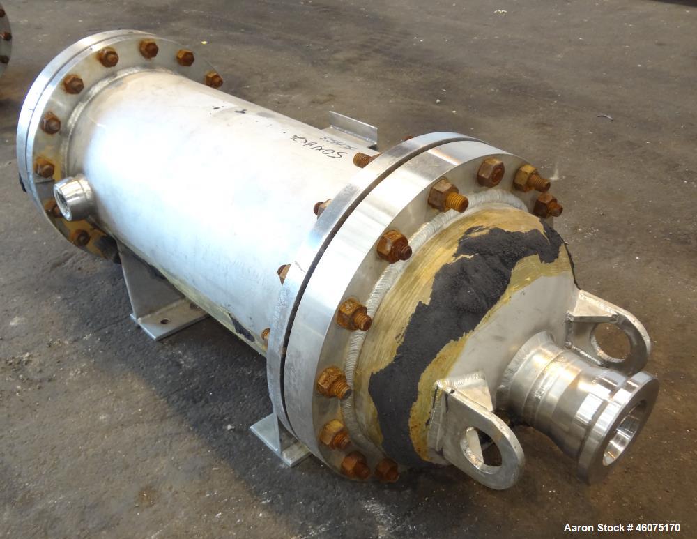 Used Chemineer Shell & Tube Heat Exchanger Static Mixer, Approximate 50 Square Feet, Vertical. 304 Stainless steel shell rated 150 psi at 100 degrees F. (64) 1" Diameter x 32" long 304 stainless stee...