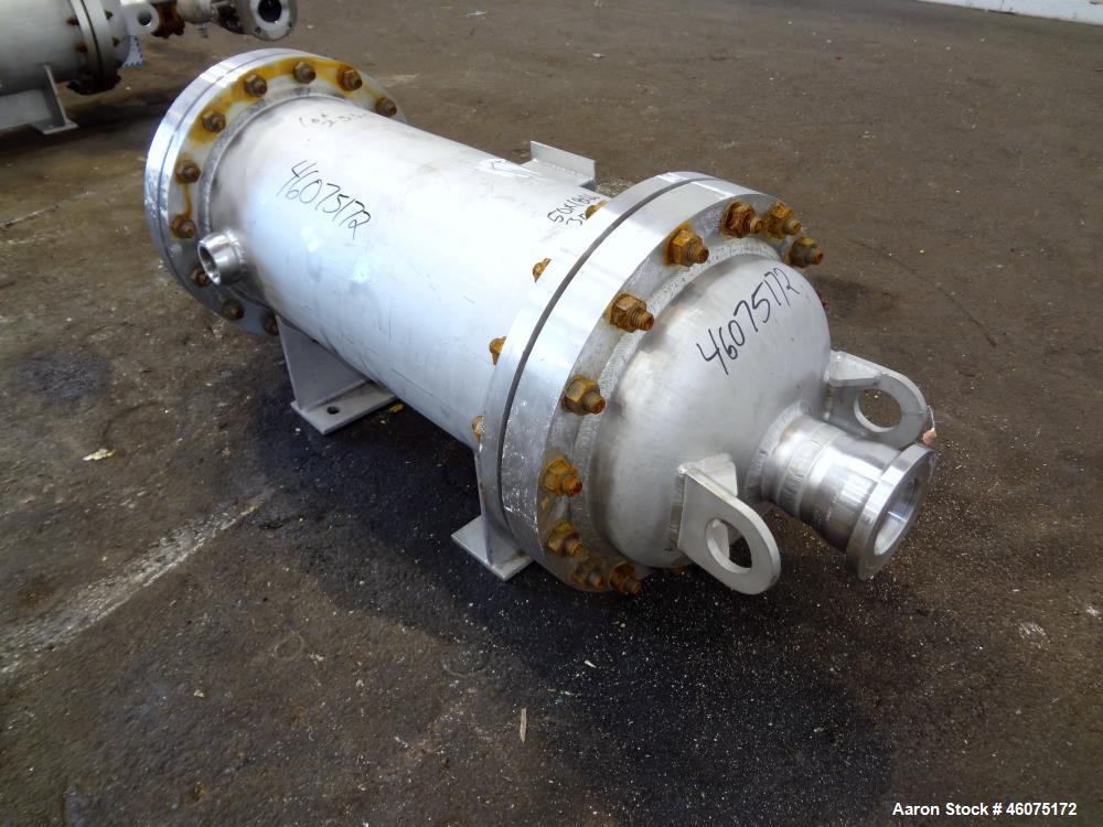 Used Chemineer Shell & Tube Heat Exchanger Static Mixer, Approximate 50 Square Feet, Vertical. 304 Stainless steel shell rated 150 psi at 100 degrees F. (64) 1" Diameter x 32" long 304 stainless stee...