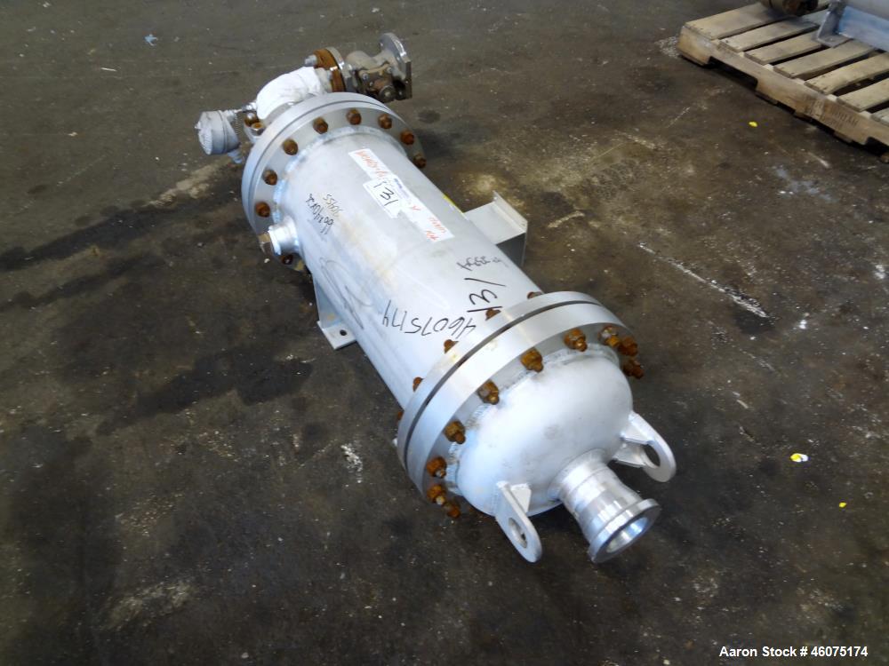 Used Chemineer Shell & Tube Heat Exchanger Static Mixer, Approximate 50 Square Feet, Vertical. 304 Stainless steel shell rated 150 psi at 100 degrees F. (64) 1" Diameter x 32" long 304 stainless stee...