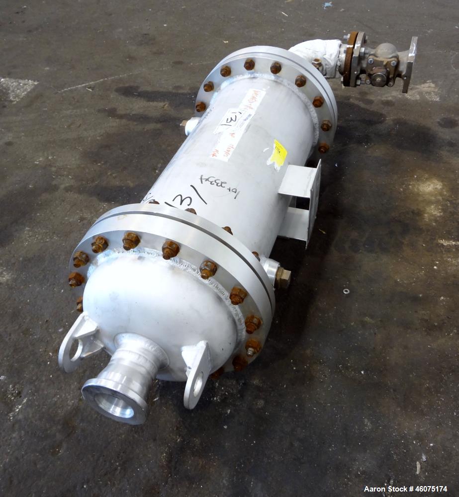Used Chemineer Shell & Tube Heat Exchanger Static Mixer, Approximate 50 Square Feet, Vertical. 304 Stainless steel shell rated 150 psi at 100 degrees F. (64) 1" Diameter x 32" long 304 stainless stee...