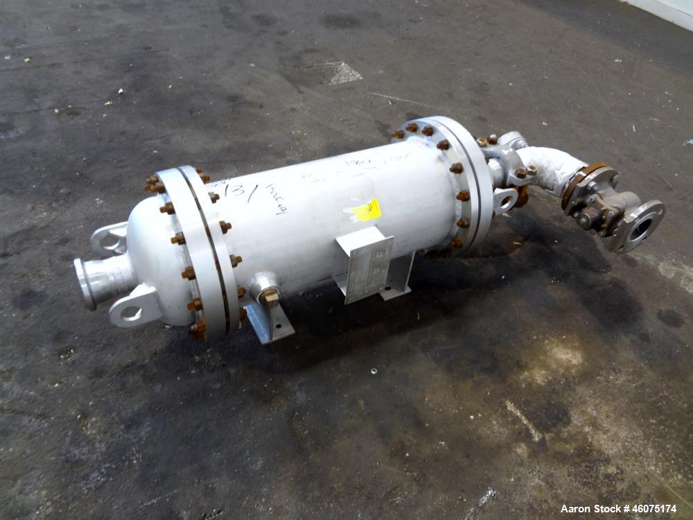 Used Chemineer Shell & Tube Heat Exchanger Static Mixer, Approximate 50 Square Feet, Vertical. 304 Stainless steel shell rated 150 psi at 100 degrees F. (64) 1" Diameter x 32" long 304 stainless stee...
