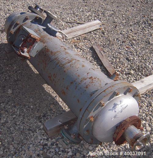 Used Doyle and Roth Shell and Tube Heat Exchanger, 98 square feet, vertical. Carbon steel shell rated 100 psi at 100 deg F, (126) 3/4" diameter x 4' long 316 stainless steel tubes rated fv/75 psi at ...