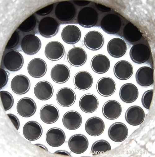 Used Doyle and Roth Shell and Tube Heat Exchanger, 98 square feet, vertical. Carbon steel shell rated 100 psi at 100 deg F, (126) 3/4" diameter x 4' long 316 stainless steel tubes rated fv/75 psi at ...