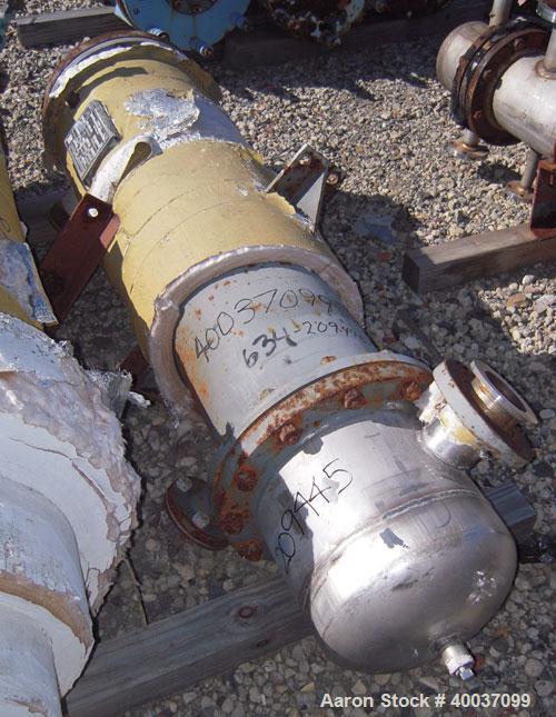 Used Doyle and Roth Shell and Tube Heat Exchanger, 98 square feet, vertical. Carbon steel shell rated 100 psi at 100 deg F, (126) 3/4" diameter x 4' long 316 stainless steel tubes rated fv/75 psi at ...
