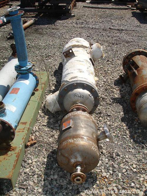 Used Doyle and Roth Shell and Tube Heat Exchanger, 98 square feet, vertical. Carbon steel shell rated 100 psi at 100 deg F, (126) 3/4" diameter x 4' long 316 stainless steel tubes rated fv/75 psi at ...