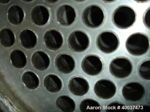 Used Doyle and Roth Shell and Tube Heat Exchanger, 98 square feet, vertical. Carbon steel shell rated 100 psi at 100 deg F, (126) 3/4" diameter x 4' long 316 stainless steel tubes rated fv/75 psi at ...