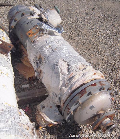 Used Doyle And Roth Shell And Tube Heat Exchanger, 98 square feet, vertical. Carbon steel shell rated 100 psi at 100 deg.f., (126) 3/4" diameter x 4' long 316 stainless steel tubes rated fv/75 psi at...