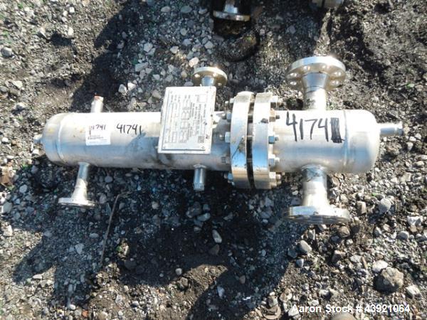 Used Doyle & Roth Shell & Tube Heat Exchanger, 4 Square Feet. 304L Stainless steel tubes, tube sheets and bonnet, U Tubes, with (13) 0.625" diameter x approximately 24" long tubes rated 150 psi and f...