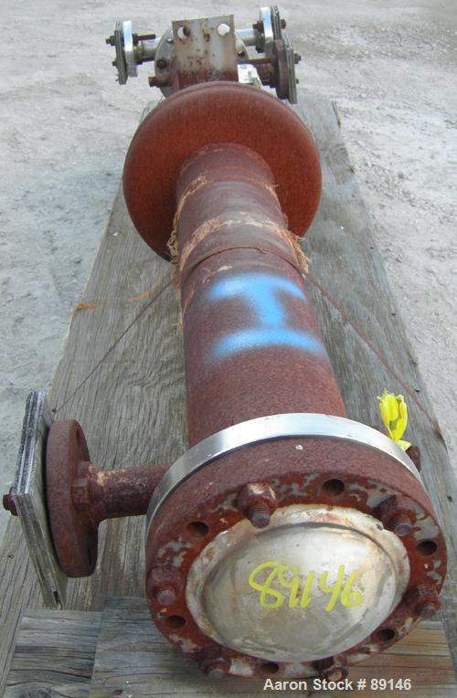 USED: Doyle and Roth multi-pass shell and tube heat exchanger, 18.8 square feet, vertical. Carbon steel shell with expansion ring rated 150 psi at 600 deg F. (16) 3/4" diameter x 72" long 316L stainl...