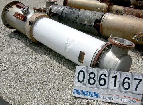 USED: Fab-Rite single pass shell and tube heat exchanger, approx 199 square feet, vertical. Carbon steel shell, stainless steel head with an 8" opening, (2) 2" nozzles for shell. Unit mounted on a 20...