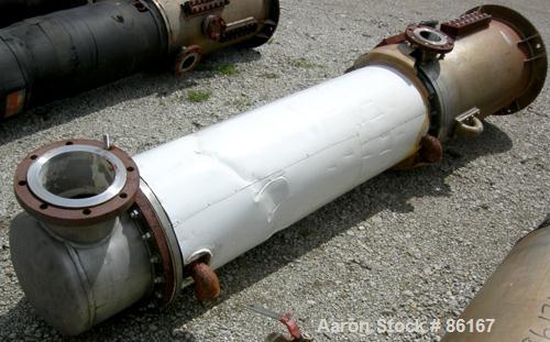 USED: Fab-Rite single pass shell and tube heat exchanger, approx 199 square feet, vertical. Carbon steel shell, stainless steel head with an 8" opening, (2) 2" nozzles for shell. Unit mounted on a 20...