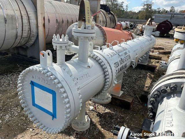 Used Fabsco 284 Square Foot Horizontal Shell and Tube Heat Exchanger. Duplex 2205 stainless steel tubes rated 150 psi at 32 to 150 degrees F, 14' Tube length, 3/4'' tube diameter. 21'' Shell diameter...