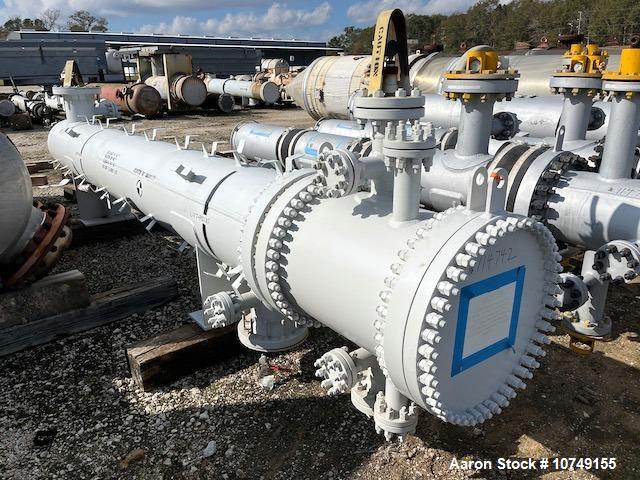 Used Fabsco 284 Square Foot Horizontal Shell and Tube Heat Exchanger. Duplex 2205 stainless steel tubes rated 150 psi at 32 to 150 degrees F, 14' Tube length, 3/4'' tube diameter. 21'' Shell diameter...