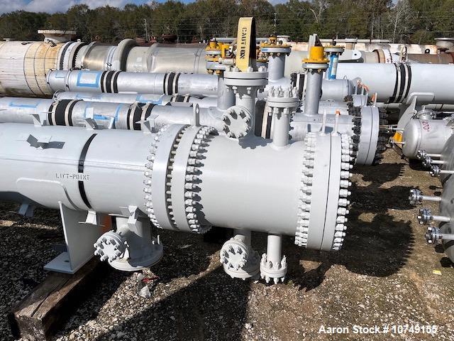 Used Fabsco 284 Square Foot Horizontal Shell and Tube Heat Exchanger. Duplex 2205 stainless steel tubes rated 150 psi at 32 to 150 degrees F, 14' Tube length, 3/4'' tube diameter. 21'' Shell diameter...