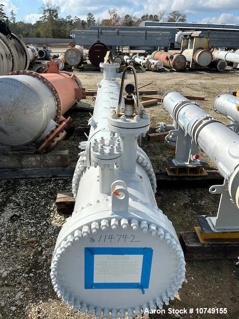 Used Fabsco 284 Square Foot Horizontal Shell and Tube Heat Exchanger. Duplex 2205 stainless steel tubes rated 150 psi at 32 to 150 degrees F, 14' Tube length, 3/4'' tube diameter. 21'' Shell diameter...