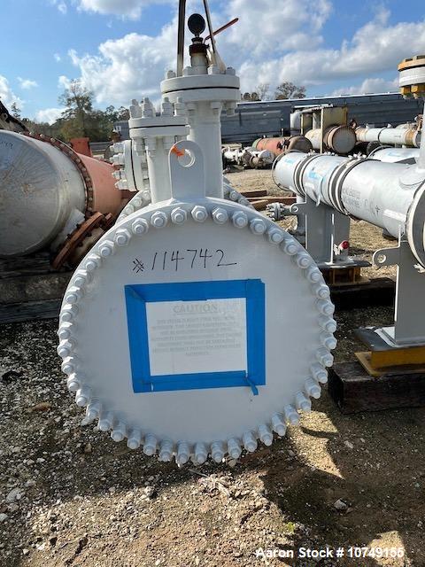 Used Fabsco 284 Square Foot Horizontal Shell and Tube Heat Exchanger. Duplex 2205 stainless steel tubes rated 150 psi at 32 to 150 degrees F, 14' Tube length, 3/4'' tube diameter. 21'' Shell diameter...