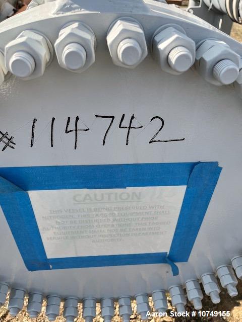Used Fabsco 284 Square Foot Horizontal Shell and Tube Heat Exchanger. Duplex 2205 stainless steel tubes rated 150 psi at 32 to 150 degrees F, 14' Tube length, 3/4'' tube diameter. 21'' Shell diameter...
