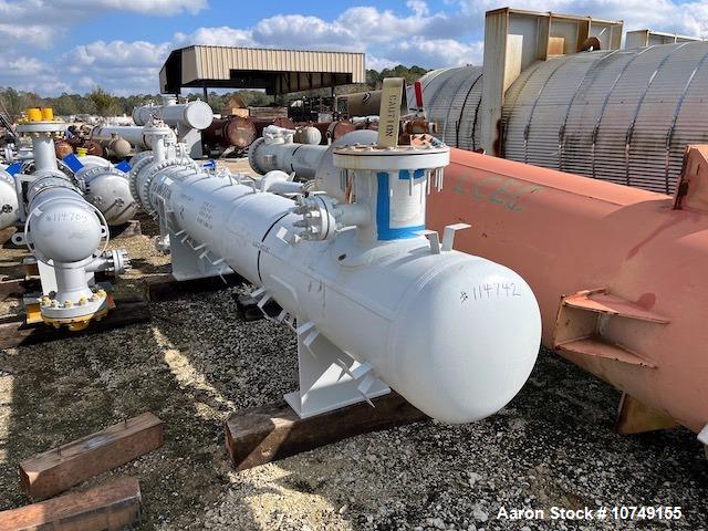 Used Fabsco 284 Square Foot Horizontal Shell and Tube Heat Exchanger. Duplex 2205 stainless steel tubes rated 150 psi at 32 to 150 degrees F, 14' Tube length, 3/4'' tube diameter. 21'' Shell diameter...