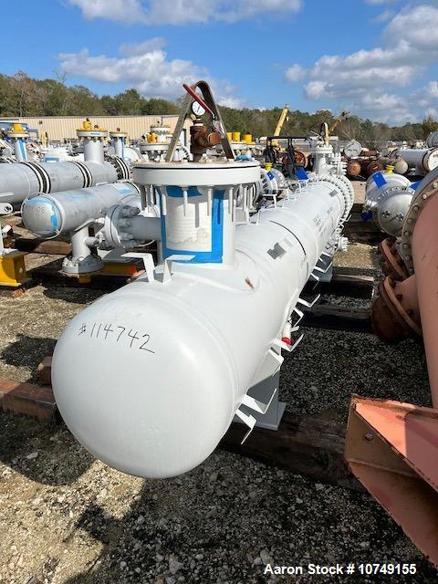 Used Fabsco 284 Square Foot Horizontal Shell and Tube Heat Exchanger. Duplex 2205 stainless steel tubes rated 150 psi at 32 to 150 degrees F, 14' Tube length, 3/4'' tube diameter. 21'' Shell diameter...