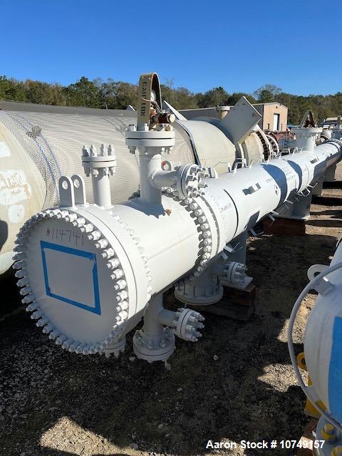 Used Fabsco Horizontal 284 sq. ft. Shell and Tube Heat Exchanger. Duplex 2205 stainless steel tubes rated 150 psi at 32 to 150 degrees F, 14' Tube length. Carbon steel head. Carbon Steel shell rated ...