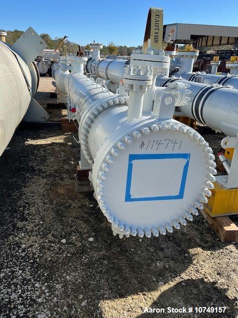 Used Fabsco Horizontal 284 sq. ft. Shell and Tube Heat Exchanger. Duplex 2205 stainless steel tubes rated 150 psi at 32 to 150 degrees F, 14' Tube length. Carbon steel head. Carbon Steel shell rated ...