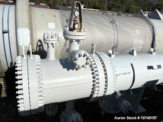 Used Fabsco Horizontal 284 sq. ft. Shell and Tube Heat Exchanger. Duplex 2205 stainless steel tubes rated 150 psi at 32 to 150 degrees F, 14' Tube length. Carbon steel head. Carbon Steel shell rated ...