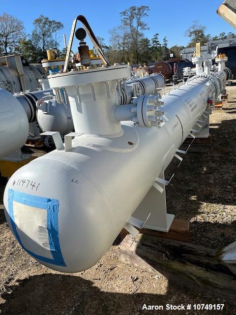 Used Fabsco Horizontal 284 sq. ft. Shell and Tube Heat Exchanger. Duplex 2205 stainless steel tubes rated 150 psi at 32 to 150 degrees F, 14' Tube length. Carbon steel head. Carbon Steel shell rated ...