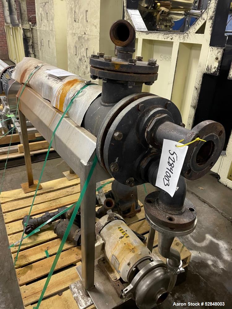 Used Feldmeier 6" x 4" x 2" Triple Tube Heater System with Hot Water Circulating Unit. Last used on citrus pulp for 20,000 lb/hr. (10) Approximate 6" diameter x 207" long tubes. 4" Product Inlet / Ou...