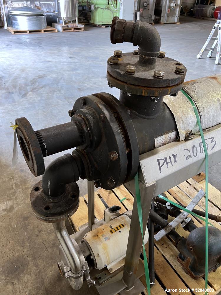 Used Feldmeier 6" x 4" x 2" Triple Tube Heater System with Hot Water Circulating Unit. Last used on citrus pulp for 20,000 lb/hr. (10) Approximate 6" diameter x 207" long tubes. 4" Product Inlet / Ou...