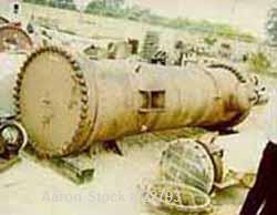 Unused-UNUSED: Foster Wheeler heat exchanger, 1871 square feet, vertical. Carbon steel shell and heads. 304 stainless steel tubes, tube sheet. 1695 tubes x 5/8" diameter x .028 BWG x 6' long, rated 7...