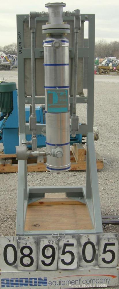 USED: Gaumer electrically heated circulation heater, 6 kW, inconel, vertical. Shell rated 150 psi at 250 deg F. (3) Elements, approximately 33" long. Flanged inlets/outlets, saddle mounted with stand...