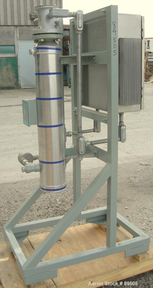 USED: Gaumer electrically heated circulation heater, 6 kW, inconel, vertical. Shell rated 150 psi at 250 deg F. (3) Elements, approximately 33" long. Flanged inlets/outlets, saddle mounted with stand...