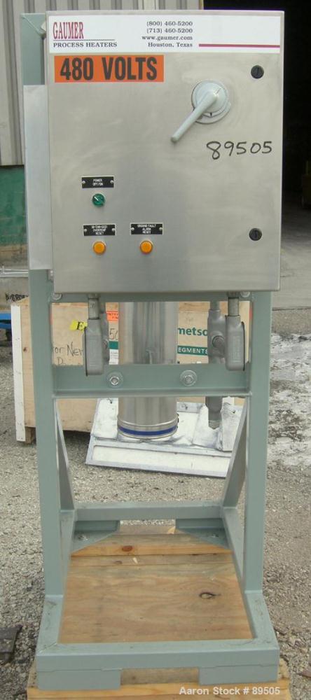 USED: Gaumer electrically heated circulation heater, 6 kW, inconel, vertical. Shell rated 150 psi at 250 deg F. (3) Elements, approximately 33" long. Flanged inlets/outlets, saddle mounted with stand...