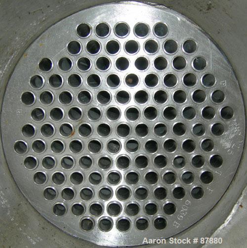 Used Graham single pass shell and tube heat exchanger, 107 square feet, horizontal. Carbon steel shell rated 75 psi at 300 deg.f., (117) 5/8" diameter x 5'  long 304 stainless steel tubes rated 75 ps...