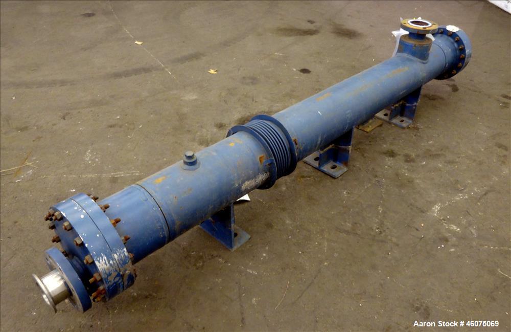 Used ITT Industries Shell & Tube Heat Exchanger, Approximate 124 Square Feet, Horizontal. Carbon steel shell rated 100 psi at -20 to 375 degrees F. (200) 3/8" Diameter x approximate 78" long 316 Stai...