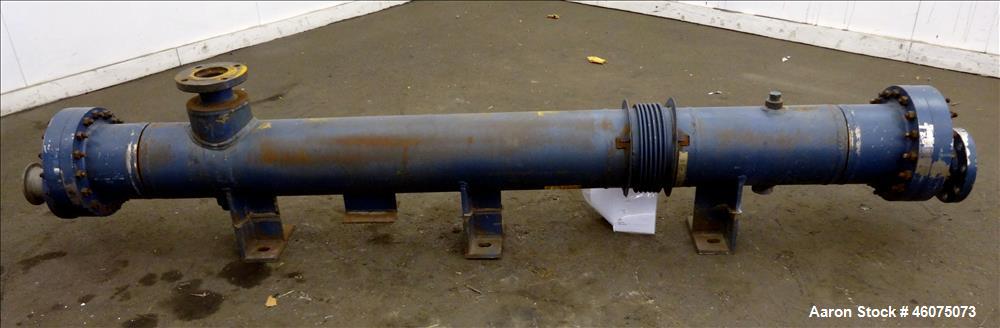 Used ITT Industries Shell & Tube Heat Exchanger, Approximate 124 Square Feet, Horizontal. Carbon steel shell rated 100 psi at -20 to 375 degrees F. (200) 3/8" Diameter x approximate 78" long 316 Stai...