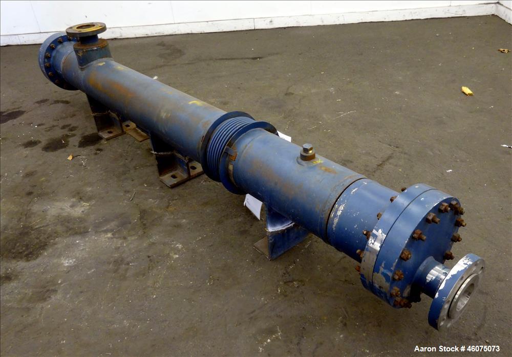 Used ITT Industries Shell & Tube Heat Exchanger, Approximate 124 Square Feet, Horizontal. Carbon steel shell rated 100 psi at -20 to 375 degrees F. (200) 3/8" Diameter x approximate 78" long 316 Stai...