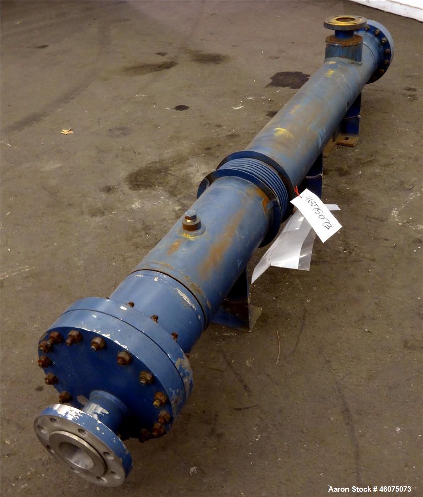 Used ITT Industries Shell & Tube Heat Exchanger, Approximate 124 Square Feet, Horizontal. Carbon steel shell rated 100 psi at -20 to 375 degrees F. (200) 3/8" Diameter x approximate 78" long 316 Stai...