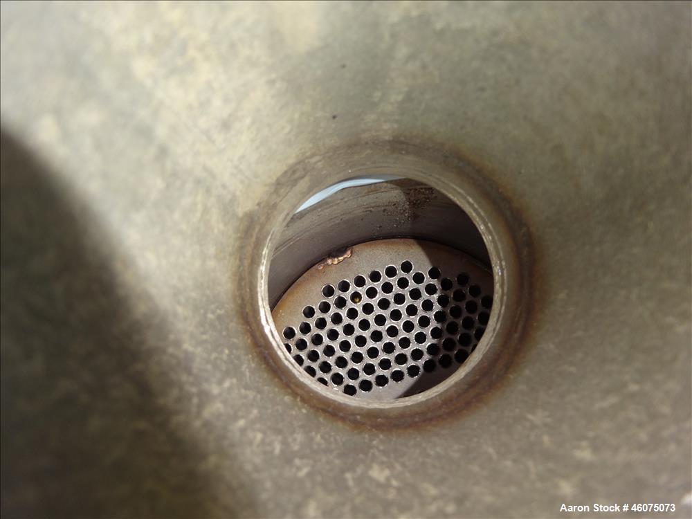 Used ITT Industries Shell & Tube Heat Exchanger, Approximate 124 Square Feet, Horizontal. Carbon steel shell rated 100 psi at -20 to 375 degrees F. (200) 3/8" Diameter x approximate 78" long 316 Stai...