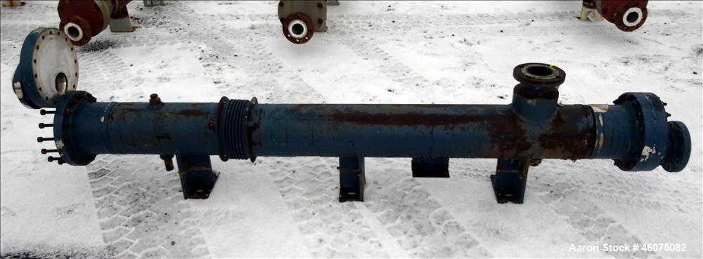 Used ITT Industries Shell & Tube Heat Exchanger, Approximate 124 Square Feet, Horizontal. Carbon steel shell rated 100 psi at -20 to 375 degrees F. (200) 3/8" Diameter x approximate 78" long 316 Stai...