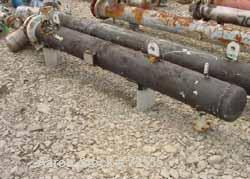 USED: Johnson-Hunt Ltd U tube heat exchanger. 92 sq ft, horizontal.Stainless steel construction on product contact parts. Carbon steelbody. 9.75" x 9'1" st side (250mm dia x 2800mm st side) body. She...
