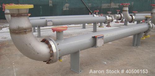 Unused- Mueller Single Pass Shell and Tube Heat Exchanger, 77 square feet, horizontal. STI Tema Type BEU, Tema Size 8-108, Tema Class C. SA53 carbon steel shell rated 150 psi at 200 deg F, and -20 de...